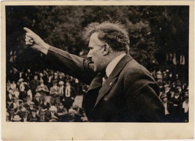 A photograph of Mayor Gray speaking to a crowd of people in Victoria Gray. His hand is raised in the air, pointing at the crowd. Source: Charles F. Gray Family fonds, University of Calgary Archives and Special Collections.