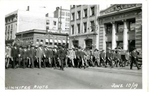 Approximately 200 Special Policemen with wagon spokes and baseball bats advance on Portage Avenue. Winnipeg Tribune fonds, June 10, 1919. UMASC.