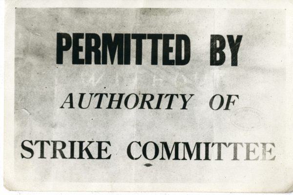 A sign allowing for the provision of essential services by permission of the Strike Committee. Pitblado Family fonds. UMASC.