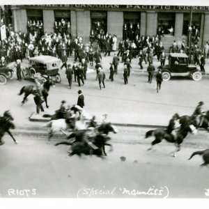 Special Policemen riding east on Portage Avenue, towards Main Street. Winnipeg Tribune fonds, June 10, 1919. UMASC.